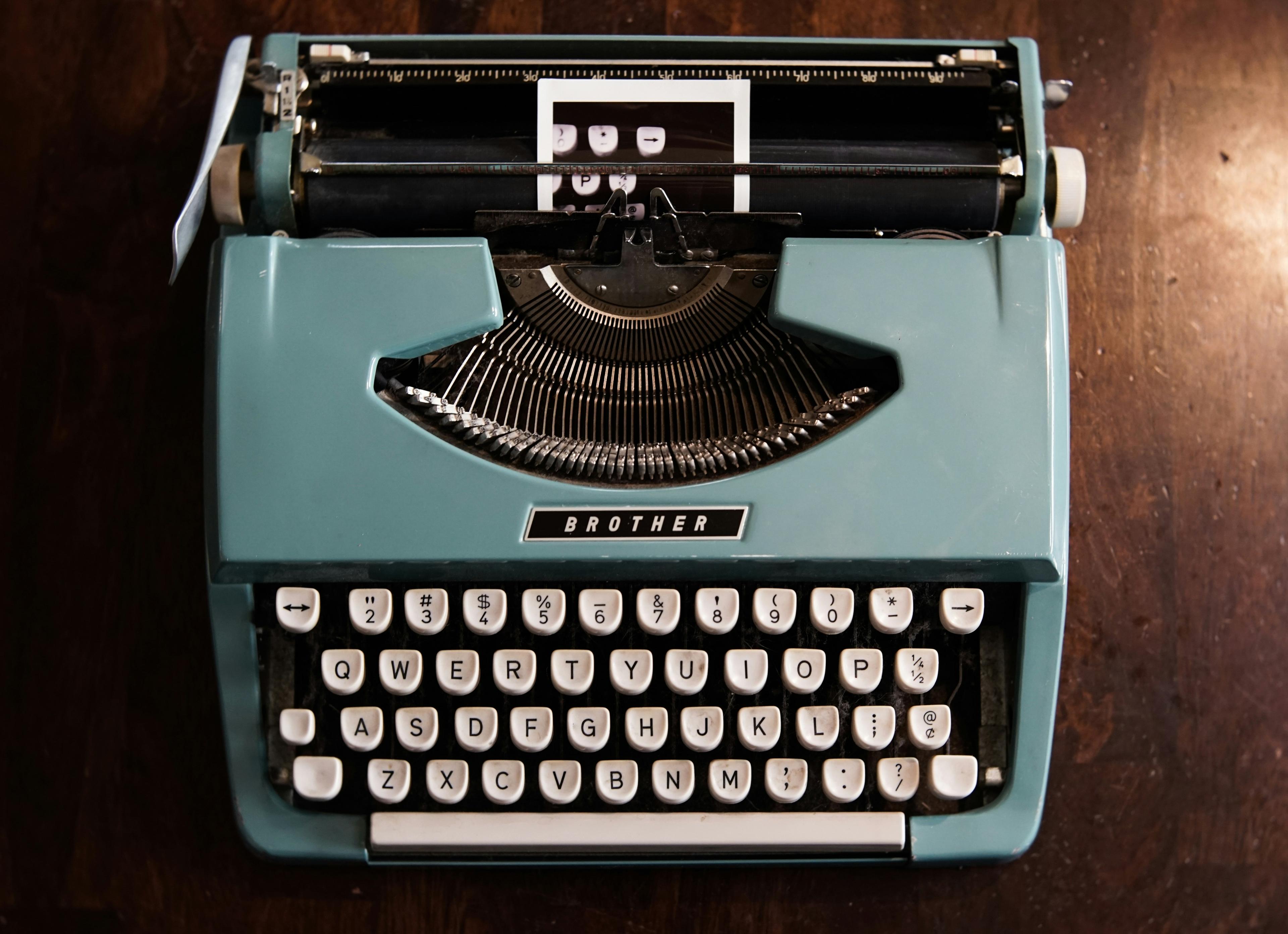 Green typewriter on table